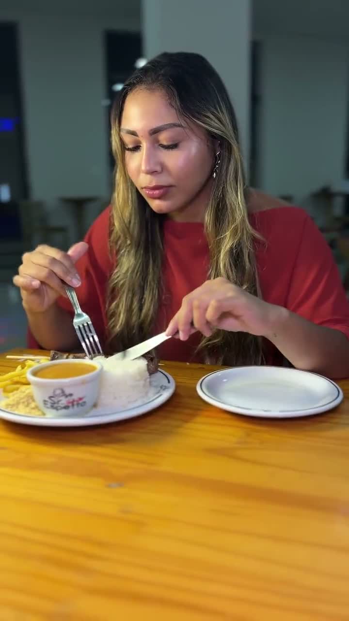Creator eating a plated meal at a neighborhood spot